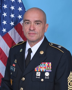 Command Sergeant Major James Perrault was born in Stuttgart, Germany. He enlisted in the Massachusetts Army National Guard on June 26, 1993, and completed Basic Training at Fort Jackson, South Carolina. He then went on to Advanced Individual Training at Fort Lee, Virginia. He began his career as a 77F Petroleum Supply Specialist, joining the 181st Infantry Company, Worcester, MA. Later in CSM Perrault’s career he became an 88M attending the Motor Transporter Course assigned to the 1166th Transportation Company in Ware, MA He served in numerous roles from wheeled vehicle driver to Squad Leader. 

He was deployed to Ft. Bragg, North Carolina in 2003 in support of Operation Enduring Freedom and then again in 2010 to Kuwait with 1166th HET Company as a platoon Sergeant and Acting First Sergeant in support of Operation Iraqi Freedom and Operation New Dawn.

His previous assignments include: 
Senior Truckmaster, 1060th Transportation Company in Framingham, MA.
Senior Truckmaster, 1166th Transportation Company in Worcester, MA 
First Sergeant,1166th Transportation Company.
Command Sergeant Major, 164th Transportation Battalion. 
Operations Sergeant Major, 151 Regional Support Group.
Command Sergeant Major, 151 Regional Support Group.

Command Sergeant Major Perrault’s military awards and decorations include the Legion of Merit, Bronze Star Medal, Meritorious Service Medal with one oak leaf cluster, Army Commendation Medal, Air Force Commendation Medal, Army Achievement Medal with Four Oak Leaf Clusters, Iraq Campaign Medal with 2 Campaign Stars, Noncommissioned Professional Development Ribbon with Numeral 5. CSM Perrault is a graduate of the Sergeants Major Academy, Class 47.

Command Sergeant Major Perrault lives in Ashburnham, MA with his wife Nicole, children Travis & Jillian and their beloved boxer Cora.