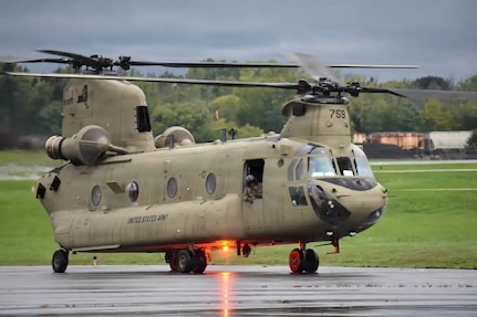 A CH-47F Chinook helicopter assigned to B Company of the 3rd General Support Helicopter Battalion, 126th Aviation Regiment, takes off from the Frederick Douglas Greater Rochester International Airport Sept. 28, 2022, heading for Jacksonville Florida to provide support to the Florida National Guard as Hurricane Ian headed for the state.