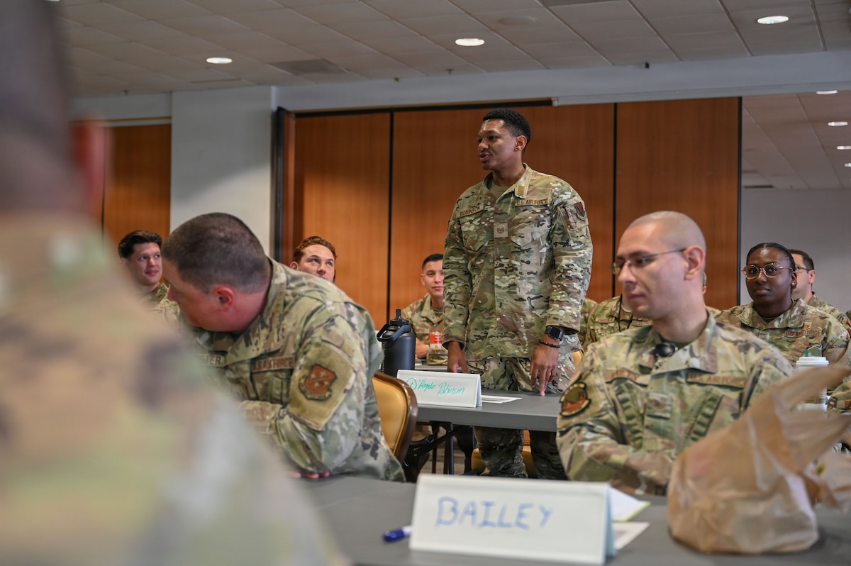 U.S. Air Force Tech. Sgt. D’Angelo Robinson, 563rd Operations Support Squadron current operations noncommissioned officer in charge, introduces himself during the Senior Noncommissioned Officer Professional Enhancement Seminar at Davis-Monthan Air Force Base, Arizona, Aug. 3, 2026. More than 30 master sergeants and master sergeant selects attended the orientation of the SNCO PES to gain various leadership tools and operational insight to better lead Airmen, strengthen mission readiness, and support the evolving demands of the force. (U.S. Air Force photo by Staff Sgt. Kahdija Slaughter)