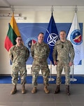 From left, Staff Sgt. Adan Mancera, cybersecurity journeyman, 171st Air Refueling Wing; Senior Master Sgt. Robert Beveridge, warfighter communications superintendent, 171st Air Refueling Wing; and Maj. Aivaras Ramanauskar, chief of cyber operations, Lithuanian Cyber Command, pose for a photo at the Lithuanian Cyber Command in Vilnius July 14, 2026.