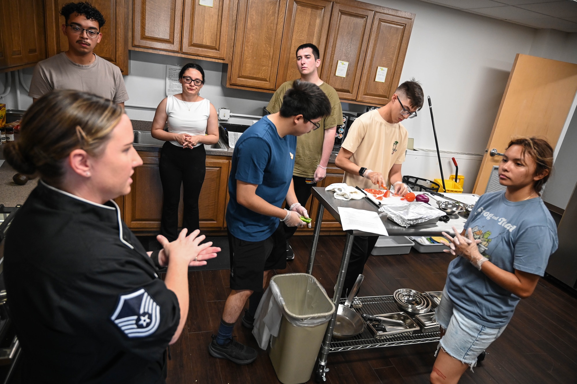 People participating in a cooking class.