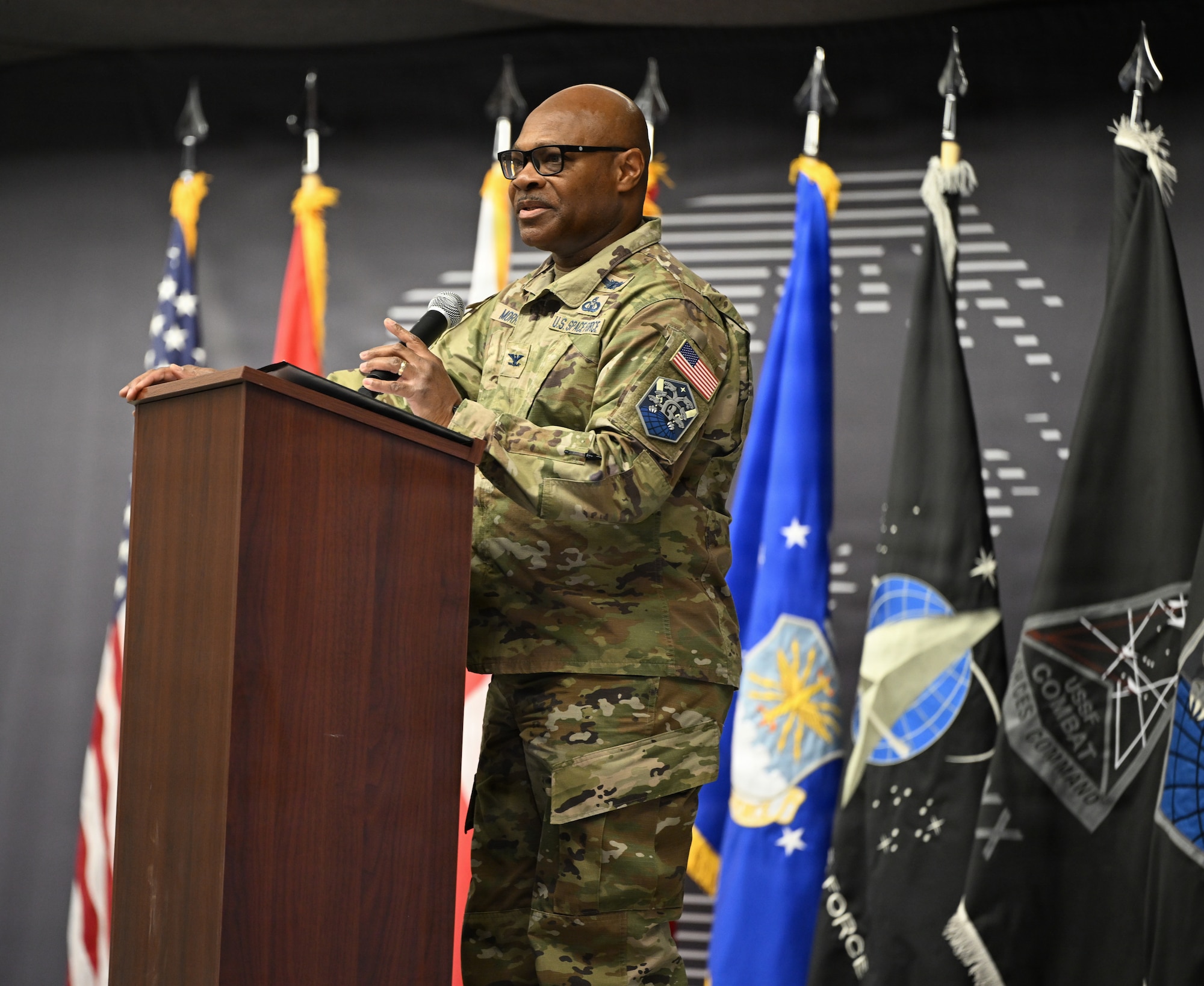 U.S. Space Force Col. Keith Morris, 821st Space Base Group incoming commander, addresses the audience at the 75th Anniversary of Pituffik Space Base at Pituffik SB, Greenland, Aug. 12, 2026.