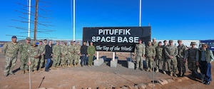 Dignitaries from the United States, Canada, the Kingdom of Denmark and Greenland pose for a photo outside the 821st Space Base Group headquarters building during the 75 Anniversary of Pituffik Space Base at Pituffik SB, Greenland, Aug. 12, 2026.