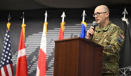 U.S. Space Force Col. Shawn Lee, 821st Space Base Group outgoing commander, gives closing remarks at the Pituffik Space Base 75th anniversary at Pituffik SB, Greenland, Aug. 12, 2026