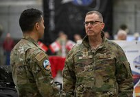 U.S. Air Force Gen. Gregory Guillot, U.S. Northern Command and North American Aerospace Defense Command commander, speaks with Senior Airman Nicolas Calero, 821st Support Squadron member at Pituffik SB Aug. 12, 2026.