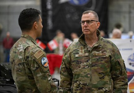 U.S. Air Force Gen. Gregory Guillot, U.S. Northern Command and North American Aerospace Defense Command commander, speaks with Senior Airman Nicolas Calero, 821st Support Squadron member at Pituffik SB Aug. 12, 2026.
