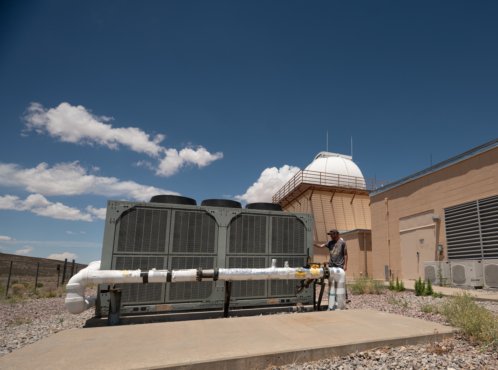 Military and Civilian team members with Mission Delta 2's 15th Space Surveillance Squadron operate and maintain the GEODSS (Ground-Based Electro-Optical Deep Space Surveillance) system at White Sands Missile Range, New Mexico, June 15, 2026. GEODSS rapidly searches for, discovers, and tracks small, dim threats in orbit. One of three locations around the globe, the New Mexico facility was the first to receive the Ground-Based Optical Sensor System (GBOSS) upgrade, which doubles the field of view, doubles the search speed and more than triples the sensitivity of what the U.S. Space Force can see on orbit. A second GEODSS facility in Hawaii completed the GBOSS upgrade in April 2026. The U.S. Space Force's scanning of earth's orbits is now done faster, wider, and clearer than ever before in Medium Earth Orbit (MEO), Geostationary Orbit (GEO), High Earth Orbit (HEO) and cislunar orbits. These enhancements demonstrate the Space Force's investments in modern technologies rapidly transitioned to the warfighter to maintain an asymmetric advantage across the continuum of conflict. (Portions of this photo have been obscured for security purposes.) (U.S. Space Force photo by Dave Grim)