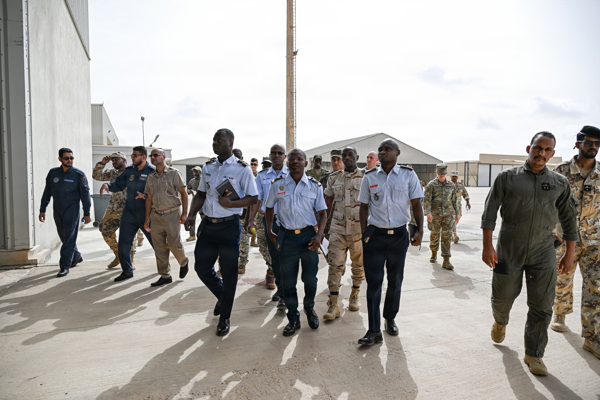U.S. Airmen and 10 African partner nation service members walk to a training session during the Mauritania Airfield Safety African Partnership Flight