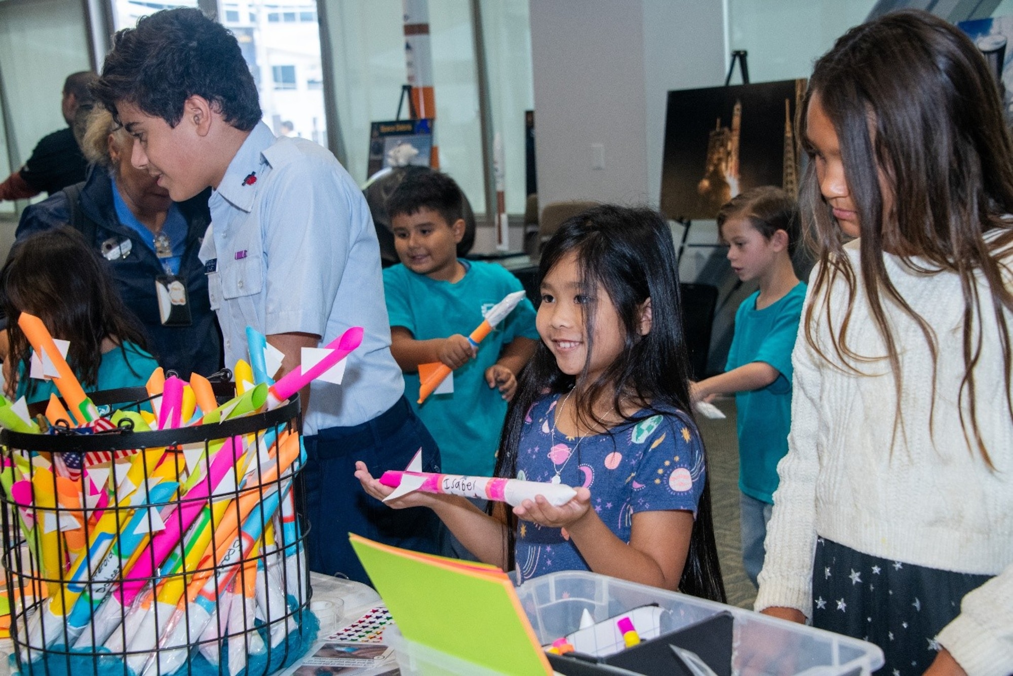 Children participate in a hands-on science activity facilitated by members of the Space Systems Command (SSC) STEM program and volunteers from the Civil Air Patrol as part of SSC’s 5th Anniversary celebration at Los Angeles Air Force Base on Aug. 13, 2026. SSC is the Nation’s premier space acquisition organization responsible for fielding space-based capabilities that protect our Nation’s interests in, from and to space. The command is headquartered at LA AFB with locations throughout the country including space launch operations at Cape Canaveral Space Force Station and Patrick Space Force Base in Fla. and Vandenberg Space Force Base in Calif. (U.S. Space Force photo by Van Ha)