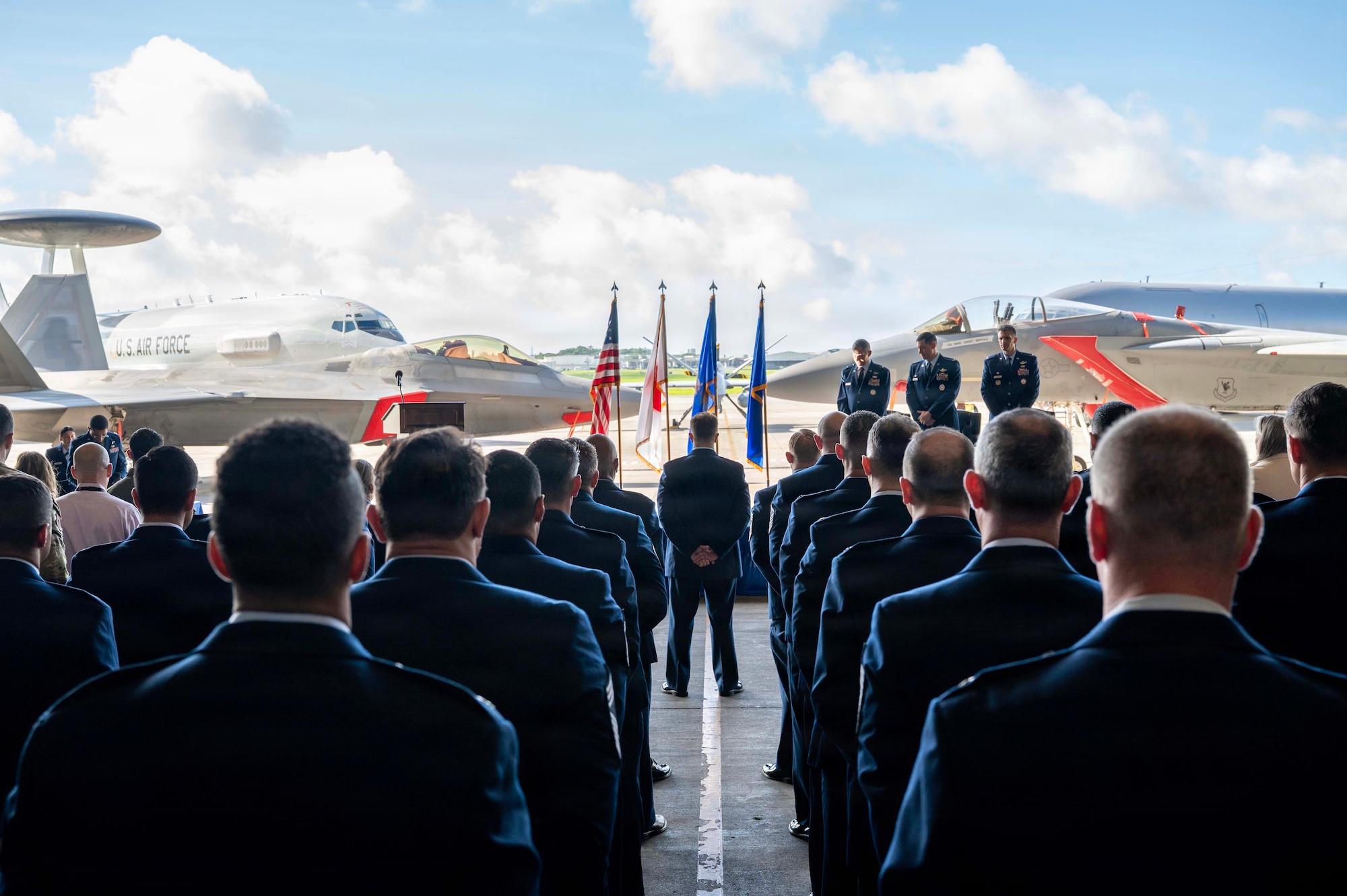 U.S. Air Force Airmen assigned to the 18th Operations Group stand at parade rest during a change of command ceremony