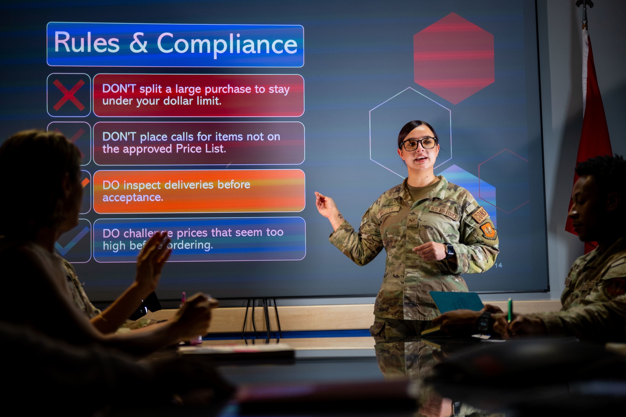 A woman briefs to a classroom.