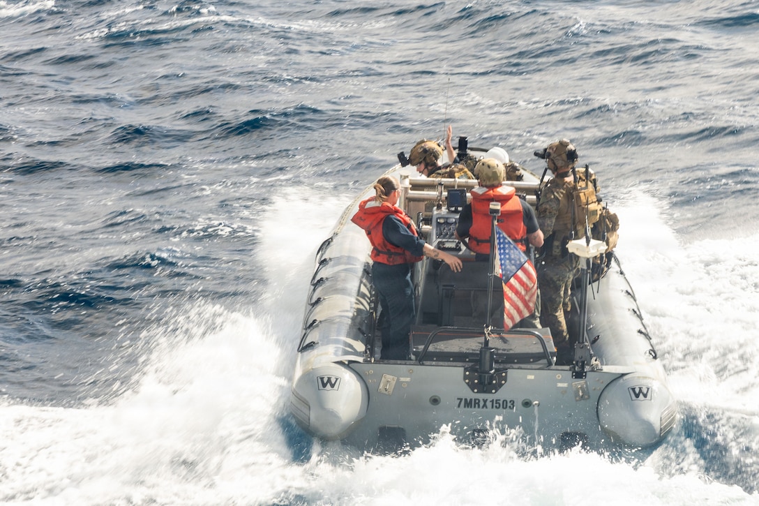 U.S. Marines with the Maritime Raid Force, Littoral Combat Force-24, and Sailors assigned to the San Antonio-class amphibious transport dock USS San Antonio (LPD 17) transit the Pacific Ocean in a rigid-hull inflatable boat after launching from the ship during a boat assault force rehearsal, Aug. 12, 2026. U.S. military forces are deployed to the U.S. Southern Command area of responsibility in support of Joint Task Force Western Hemisphere, Department of War-directed operations, and the President's priorities to disrupt illicit drug trafficking, deter malign actors and protect the homeland through continuous presence. (U.S. Marine Corps photo)