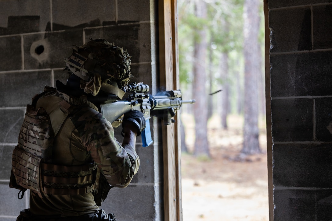 A Dutch Marine suppresses the enemy forces during a force-on-force urban operations simulation as part of exercise Burmese Chase 26, at Marine Corps Base Camp Lejeune, North Carolina, Aug. 2, 2026. Burmese Chase is an annual U.S. led, multi-lateral training exercise comprised of integrating ground and air fires, infantry tactics and naval gunfire alongside NATO allies to enhance combat readiness and interoperability. (U.S. Marine Corps photo by Lance Cpl. Sabine Wilson)