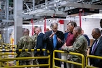 People touring a warehouse.