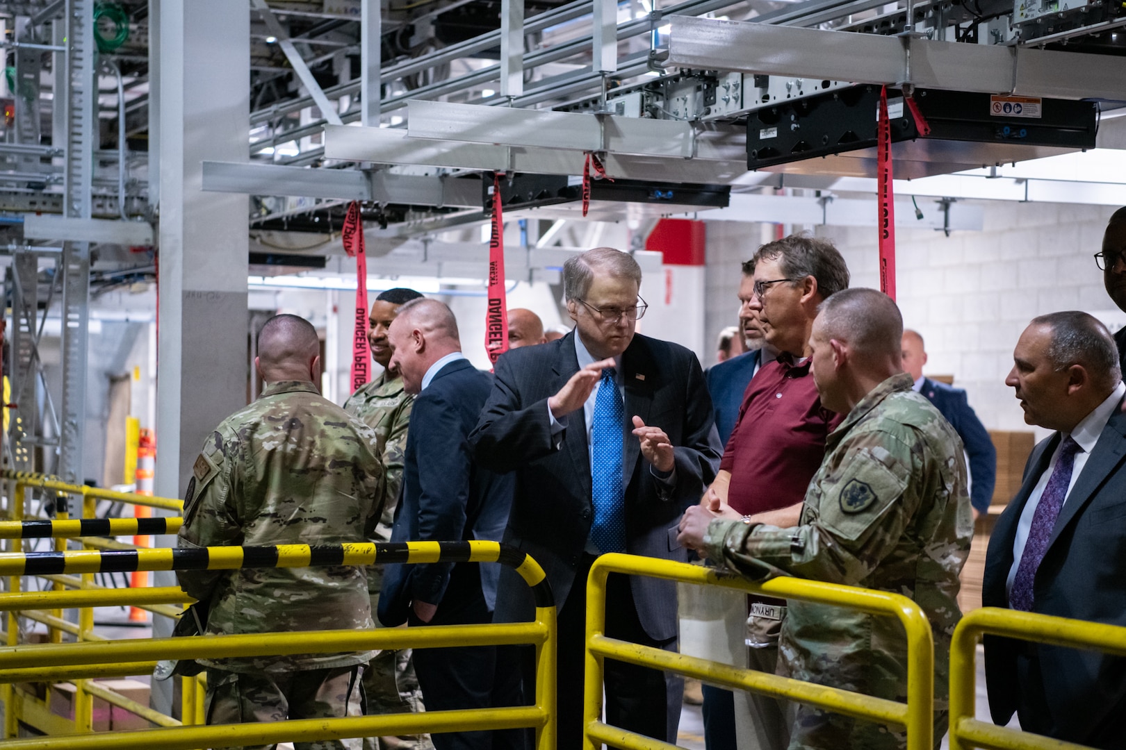 People touring a warehouse.