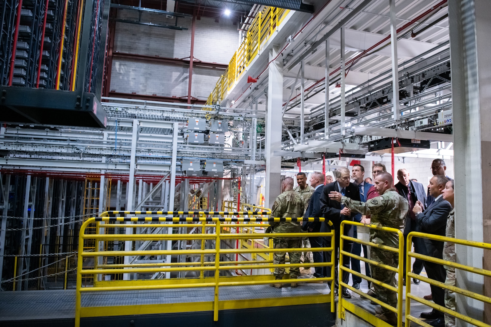 People touring a warehouse.