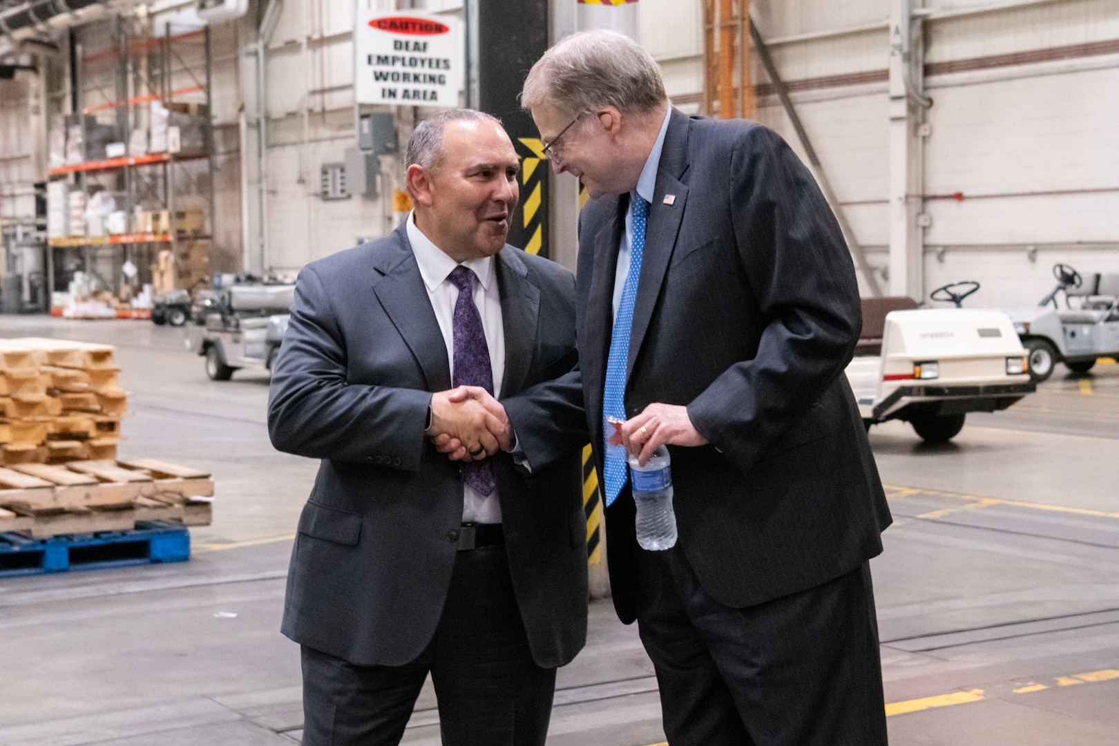 Two men shaking hands.