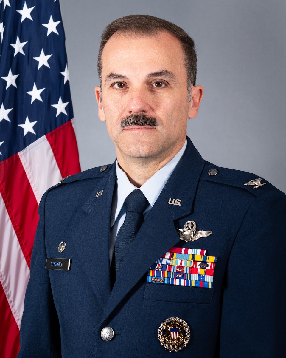 U.S. Air Force Col. Robert "Ripper" Sturgill Jr., 7th Bomb Wing commander, poses for an official photo at Dyess, Air Force Base, Texas, Aug. 17, 2026. Sturgill stands in front of the U.S. Flag in his service dress.
