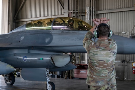 Gen. Gregory Guillot, commander of the North American Aerospace Defense Command (NORAD) and U.S. Northern Command (USNORTHCOM), is marshaled into a hangar after riding in an F-16 Fighting Falcon during a visit at Eielson Air Force Base, Alaska, Aug. 13, 2026. Guillot visited the wing to meet with leaders and Airmen, fly with the 354th Fighter Wing, and discuss the critical importance of the Alaskan NORAD region and its mission of homeland and North American defense. (U.S. Air Force photo by Senior Airman Nicholas Paczkowski)
