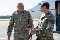 Danish Gen. Michael Hyldgaard, the Chief of Defense for the Kingdom of Denmark, left, speaks with U.S. Air Force Col. Matthew Johnston, 354th Fighter Wing commander, after arriving at Eielson Air Force Base, Alaska, Aug. 12, 2026. Hyldgaard visited the Alaskan NORAD region to observe joint operations and reinforce the strategic partnership between the United States and the Kingdom of Denmark in securing the Arctic region. (U.S. Air Force photo by Senior Airman Nicholas Paczkowski)