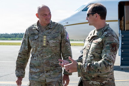 Danish Gen. Michael Hyldgaard, the Chief of Defense for the Kingdom of Denmark, left, speaks with U.S. Air Force Col. Matthew Johnston, 354th Fighter Wing commander, after arriving at Eielson Air Force Base, Alaska, Aug. 12, 2026. Hyldgaard visited the Alaskan NORAD region to observe joint operations and reinforce the strategic partnership between the United States and the Kingdom of Denmark in securing the Arctic region. (U.S. Air Force photo by Senior Airman Nicholas Paczkowski)