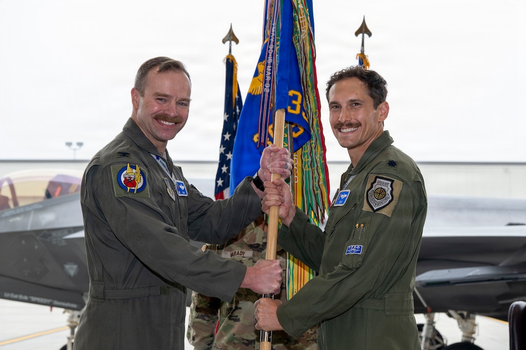 U.S. Air Force Lt. Col. Christopher Severino, right, assumes command of the 355th Fighter Squadron from U.S. Air Force Col. Samuel Chipman, 354th Operations Group commander, during a change of command ceremony at Eielson Air Force Base, Alaska, Aug. 14, 2026.