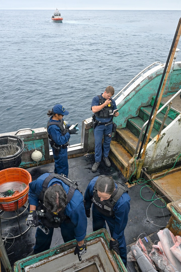 Boarding team members assigned to U.S. Coast Guard Legend-class cutter Midgett (WMSL 757) conduct a law enforcement boarding under the Regional Fisheries Management Organizations (RFMO) authority in the Pacific Ocean, July 2, 2026. RFMO boardings ensure compliance with international fisheries regulations and counter illegal, unregulated and unreported fishing in the Pacific Ocean. (U.S. Coast Guard Photo by Petty Officer 3rd Class Austin Wiley)