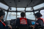 A U.S. Coast Guard long-range interceptor boatcrew from the Legend-class cutter Midgett (WMSL 757) monitors boarding team members conducting a law enforcement boarding of a fishing vessel under Regional Fisheries Management Organizations authority in the Pacific Ocean, July 2, 2026. RFMO boardings ensure compliance with international fisheries regulations and counter illegal, unregulated and unreported fishing in the Pacific Ocean. (U.S. Coast Guard Photo by Petty Officer 3rd Class Austin Wiley)