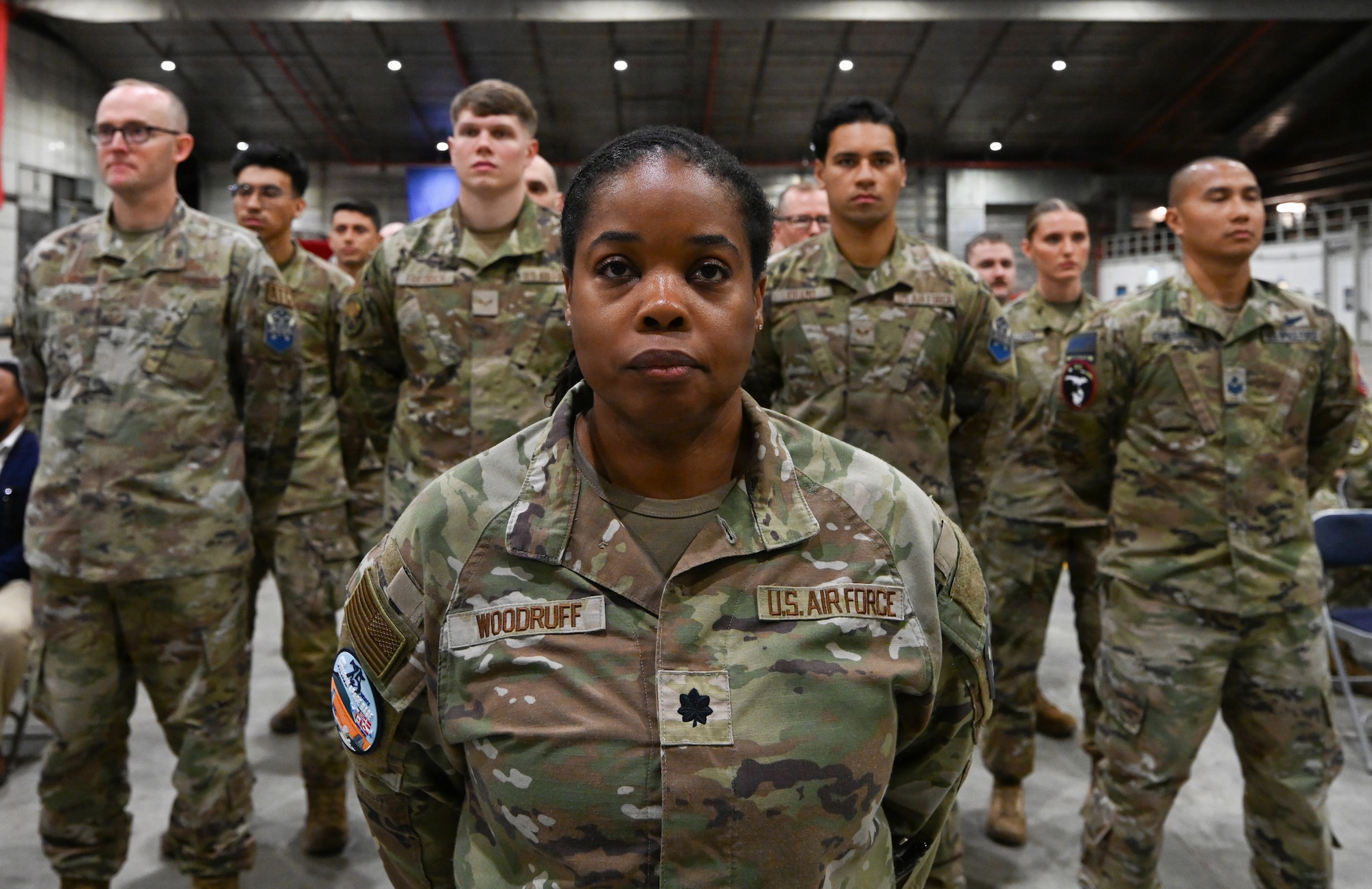 Airmen stand in formation.