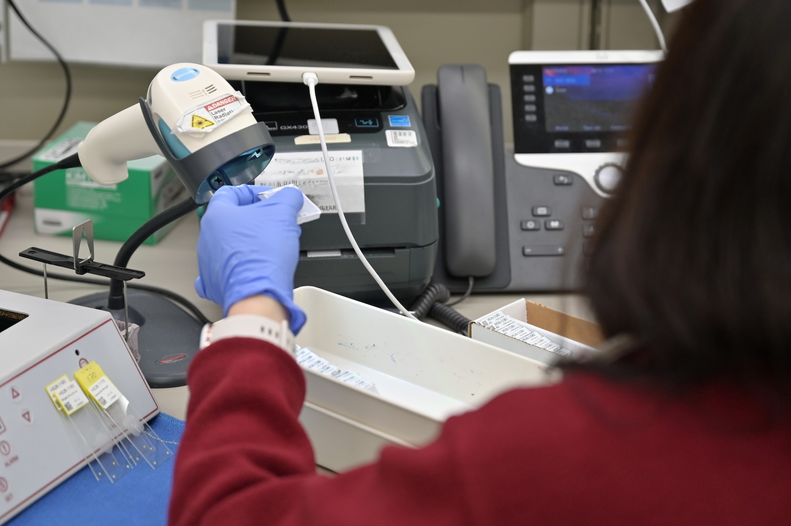 A medical laboratory technician scans a specimen in the Carl R. Darnall Army Medical Center Laboratory. Careful identification and verification are among the many steps laboratory staff take to ensure accurate and reliable test results.