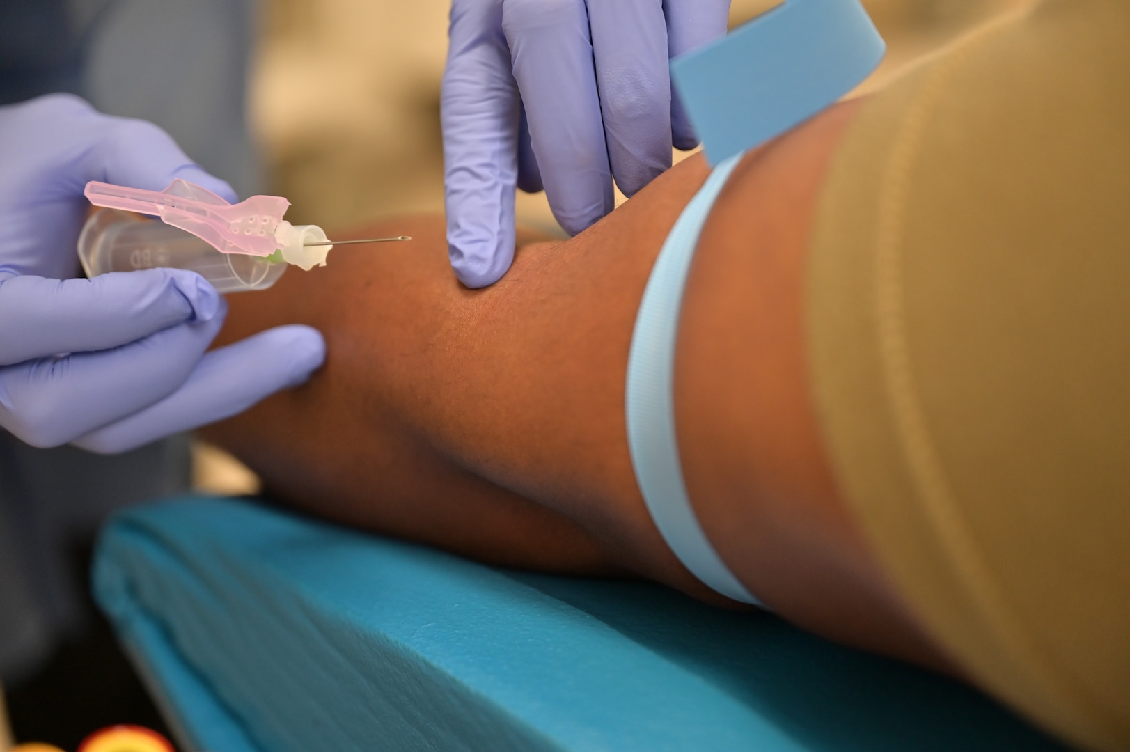 A patient prepares to have blood drawn at Carl R. Darnall Army Medical Center. While the blood draw may be a patient’s most visible interaction with the laboratory, much of the work that follows happens behind the scenes — ensuring providers have the information they need to care for their patients.