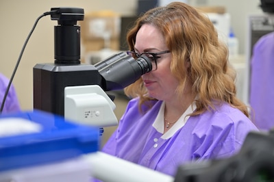 A medical laboratory technician examines a sample under a microscope in the Carl R. Darnall Army Medical Center Laboratory. The laboratory team works behind the scenes to identify and analyze specimens that help providers make informed decisions about patient care.