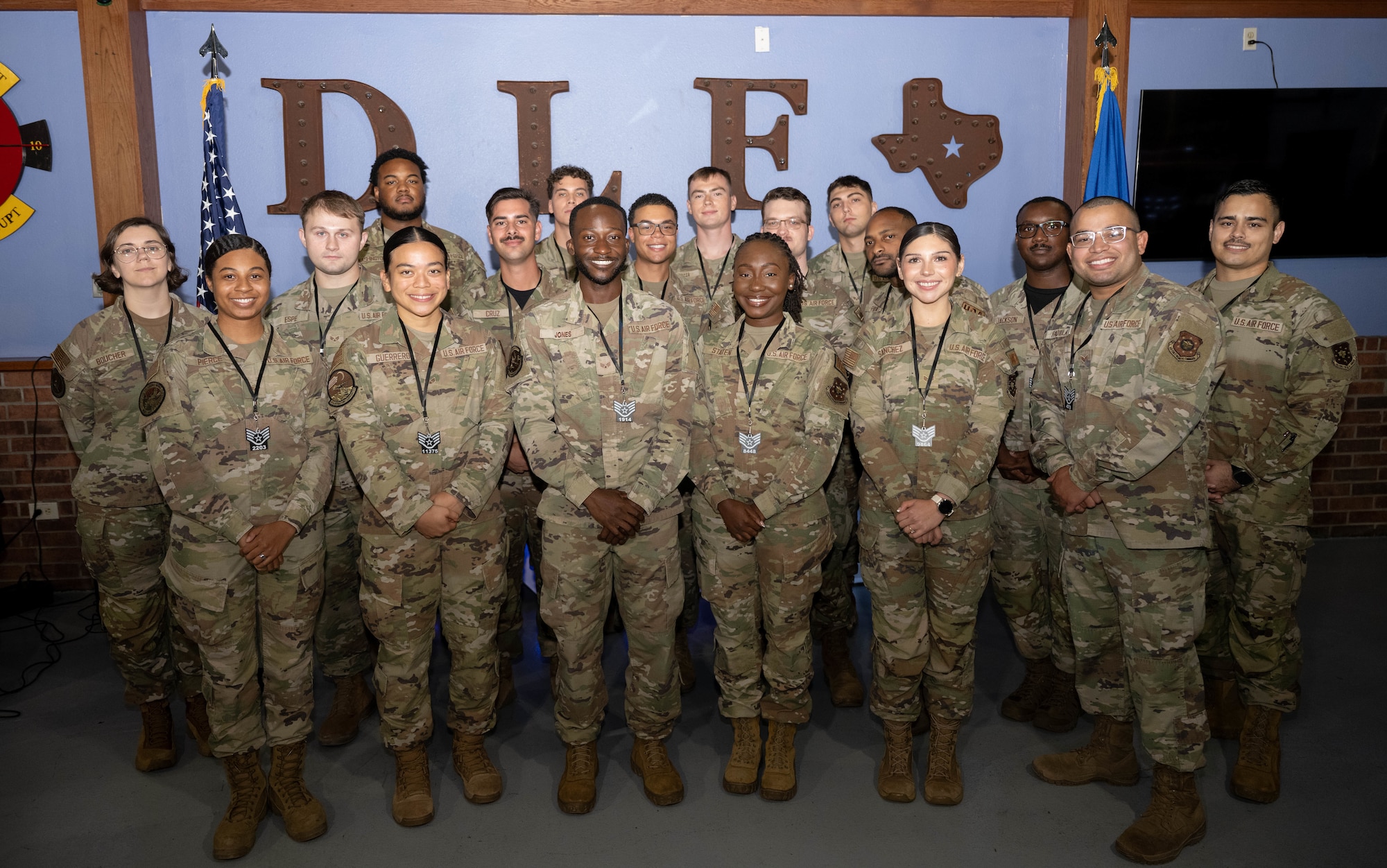 Laughlin’s newest staff sergeant selects pose for a group photo during a Staff Sergeant Release Party at Laughlin Air Force Base, Texas, August 14, 2026. Air Force officials selected 12,671 Senior Airmen for promotion to Staff Sergeant out of 39,774 eligibles for a selection rate of 31.86 percent in the 26E5 promotion cycle. (U.S. Air Force photo by Airman 1st Class Darryl Keith)