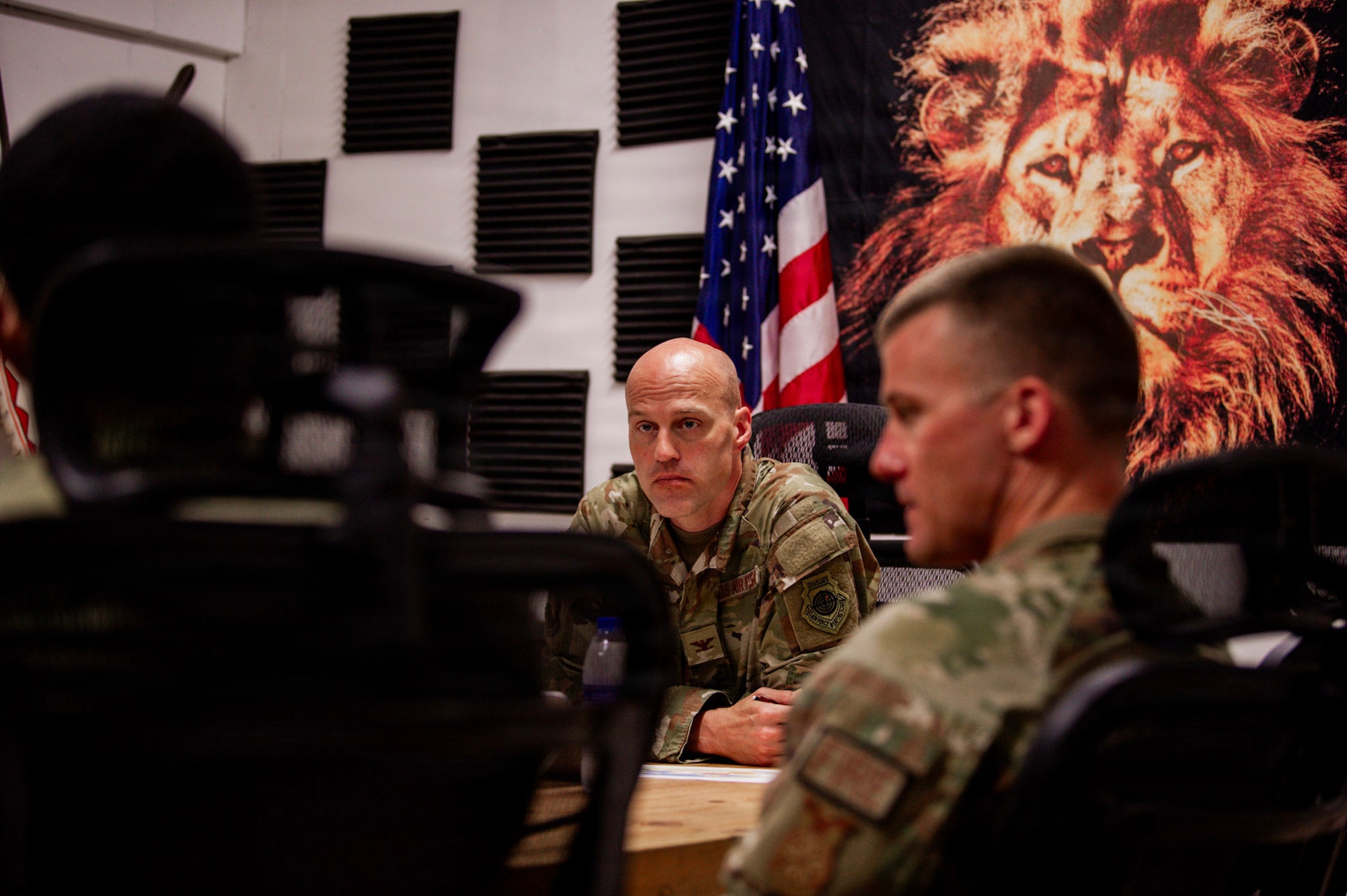 U.S. Air Force Col. Andrew Saylor, 449th Air Expeditionary Group commander, center, listens to a brief during an immersion with the 475th Expeditionary Air Base Squadron at Manda Bay, Kenya, August 8, 2026. The 475th EABS delivers agile airbase support that enables air operations, force protection and mission sustainment throughout the region. (U.S. Army photo by Sgt. Jake Anico)