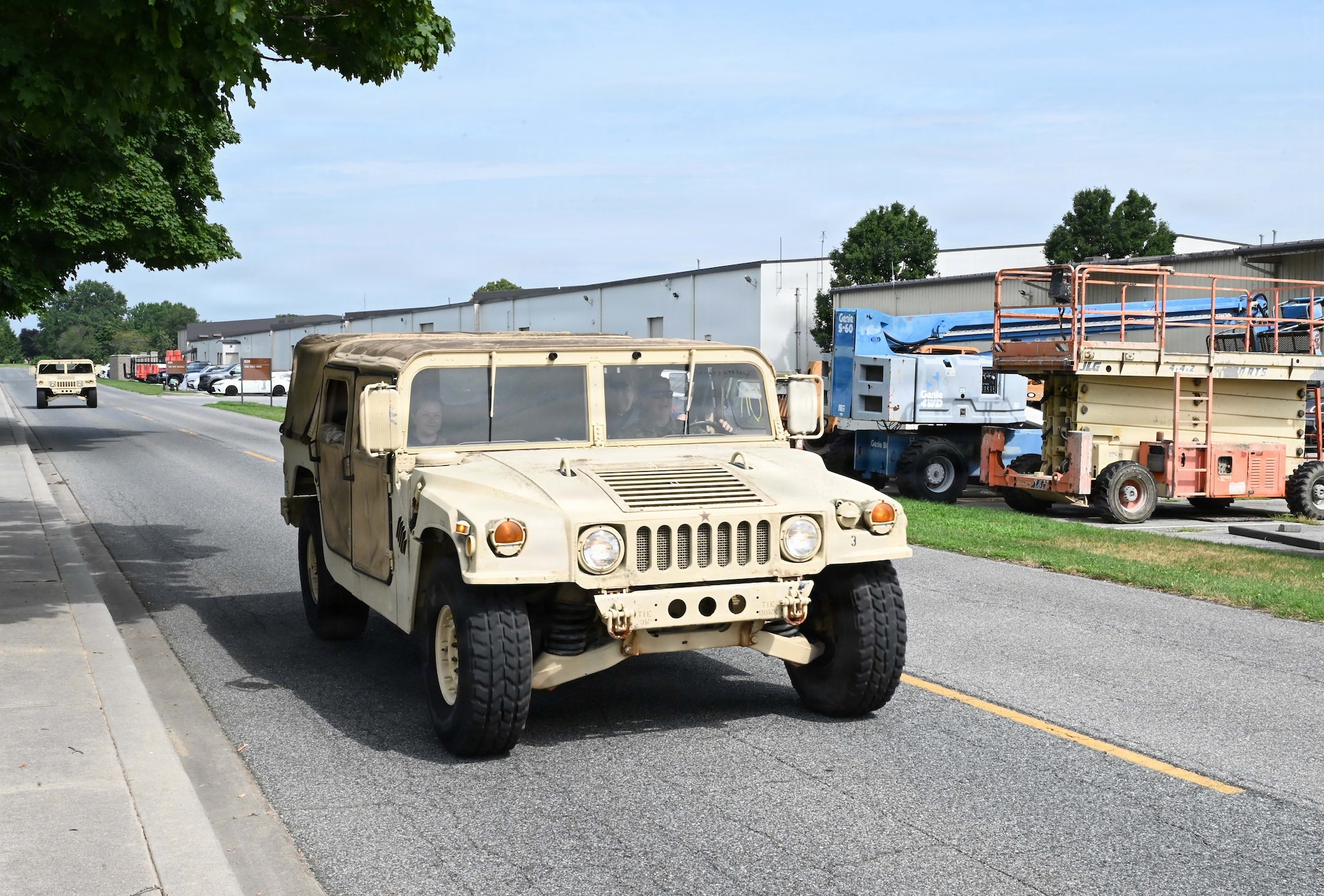 Defenders with the 512th Security Forces Squadron listen to instruction during Humvee familiarization training at Dover Air Force Base, Delaware, July 11, 2026. Twenty reservists completed the certification training.  (U.S. Air Force photo by Jeremy Larlee)