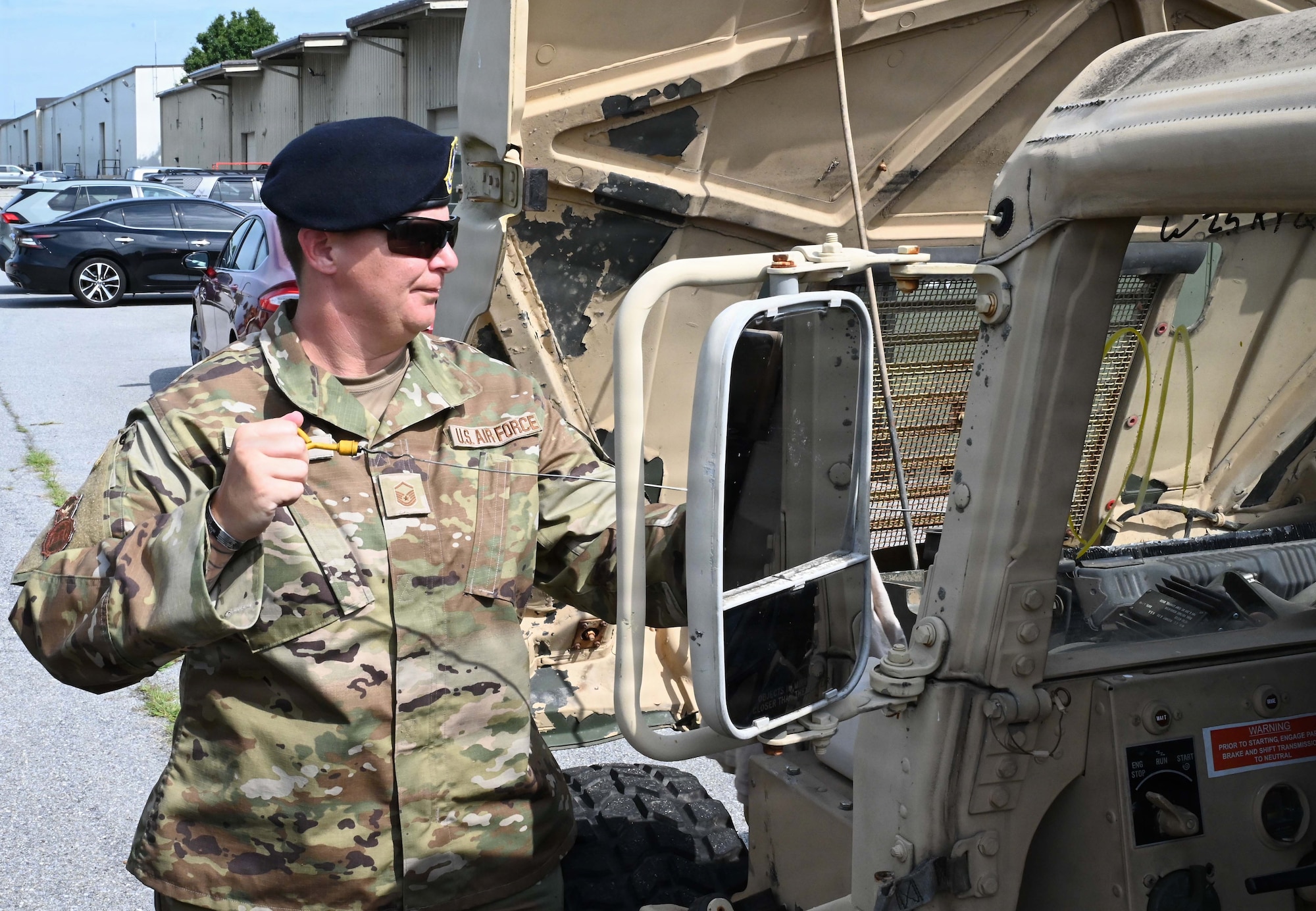 Defenders with the 512th Security Forces Squadron listen to instruction during Humvee familiarization training at Dover Air Force Base, Delaware, July 11, 2026. Twenty reservists completed the certification training.  (U.S. Air Force photo by Jeremy Larlee)