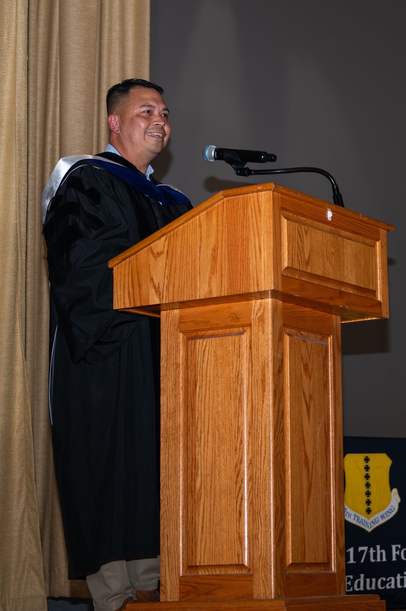 Dr. Ernie Nabors, Community College of the Air Force alumnus and guest speaker, speaks during the CCAF graduation ceremony at Goodfellow Air Force Base, Texas, July 31, 2026.