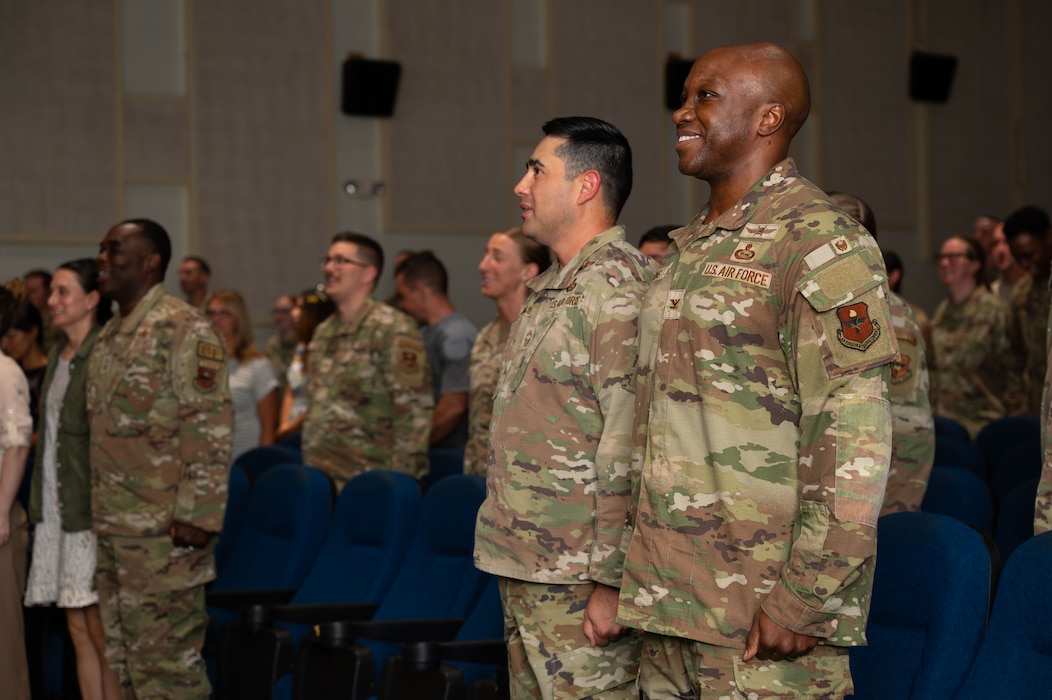 U.S. Air Force Col. Robert Watkins, 17th Training Wing deputy commander, right, and Chief Master Sgt. Marcus Naranjo, 17th Training Group senior enlisted leader, left, attend a Community College of the Air Force graduation ceremony at Goodfellow Air Force Base, Texas, July 31, 2026.