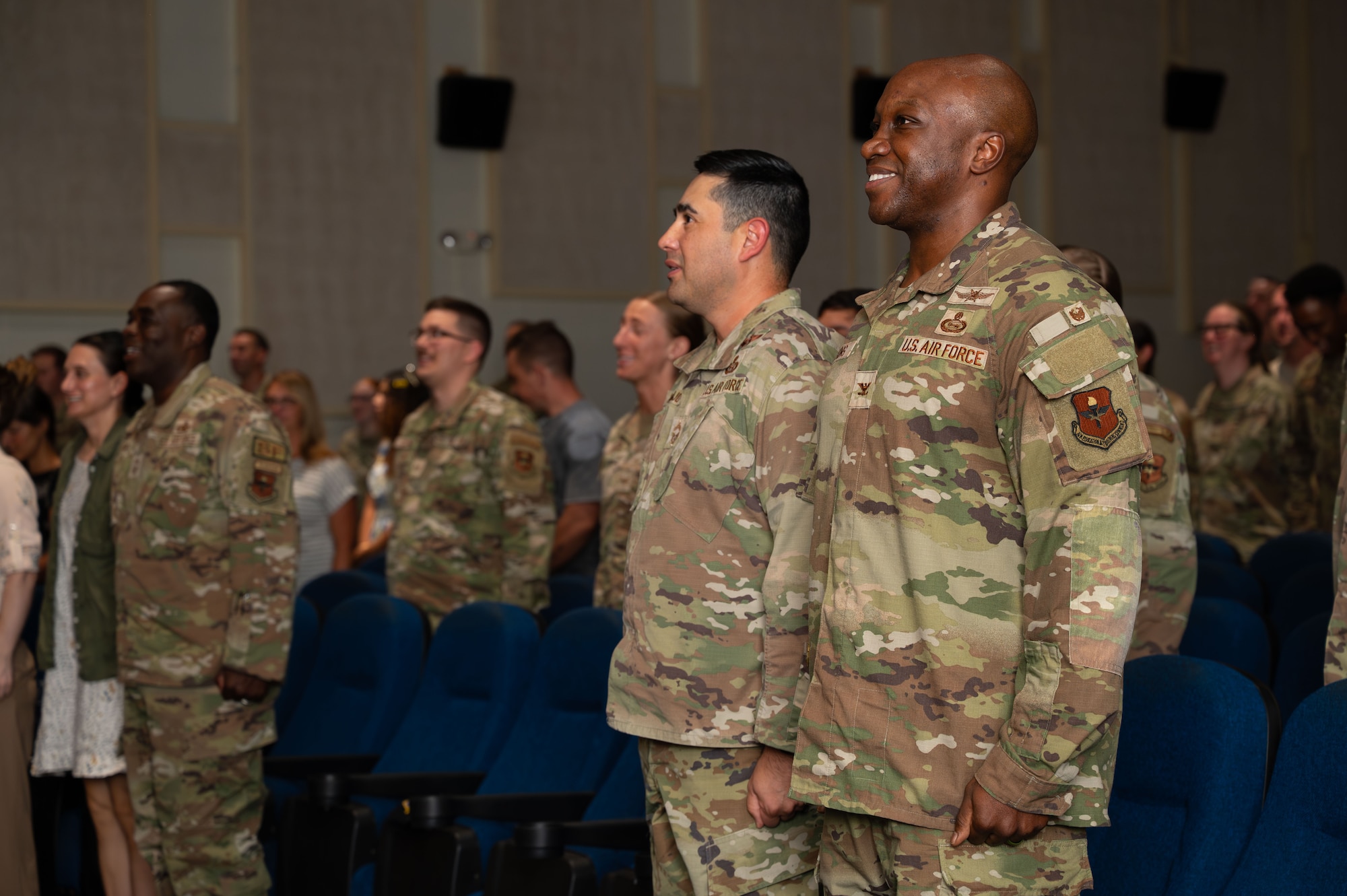 U.S. Air Force Col. Robert Watkins, 17th Training Wing deputy commander, right, and Chief Master Sgt. Marcus Naranjo, 17th Training Group senior enlisted leader, left, attend a Community College of the Air Force graduation ceremony at Goodfellow Air Force Base, Texas, July 31, 2026.