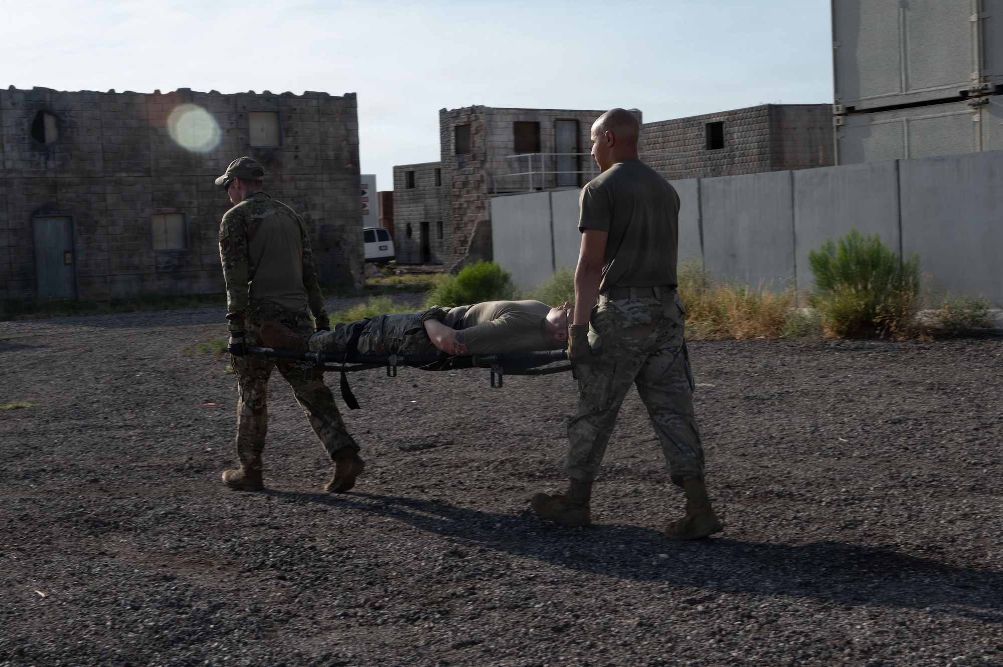 U.S. Air Force Senior Noncommissioned Officer Professional Enhancement Seminar participants navigate a simulated extraction scenario at Davis-Monthan Air Force Base, Arizona, Aug. 5, 2026. The scenario tested technical problem-solving, spatial awareness and resource utilization in order to complete the mission under physically stressful circumstances. (U.S. Air Force photo by Airman Najzee Kuzu)
