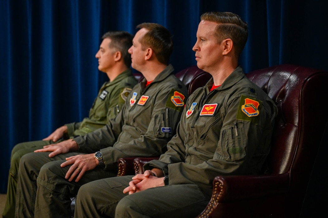From left, U.S. Air Force Col. Matthew Wilson, 56th Operations Group commander, Lt. Cols. Christopher Umphres, outgoing 56th Operations Support Squadron commander, and Christopher Tegtmeyer, incoming 56th OSS commander, participate in the squadron’s change of command ceremony at Luke Air Force Base, Arizona, Aug. 14, 2026.