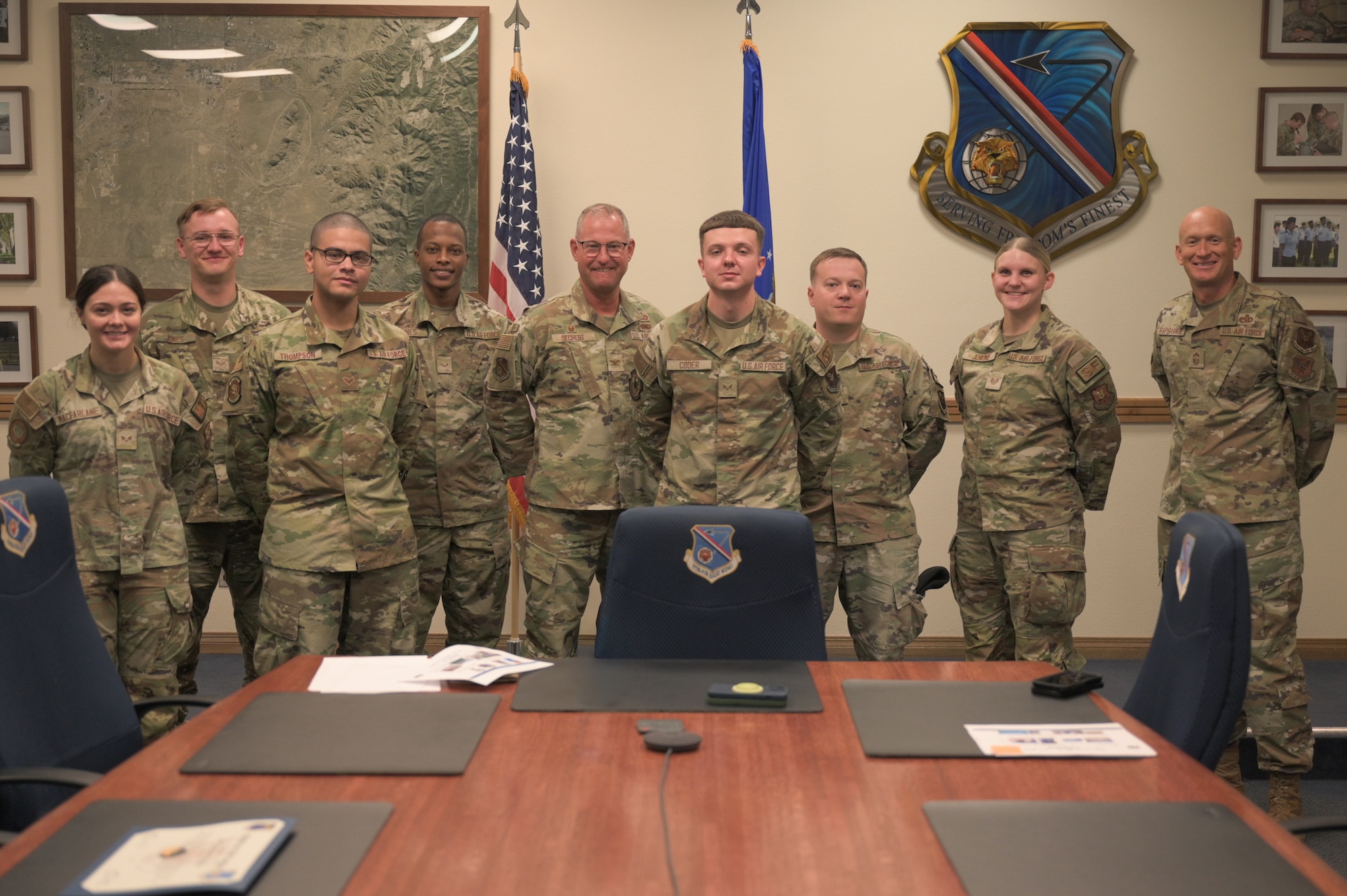 Col. Justin D. Secrest, 377th Air Base Wing commander, and Chief Master Sgt. Andrew Rapsavage, 377th ABW command chief, meet with recent Tiger of the Week recipients at Kirtland Air Force Base, New Mexico, Aug. 17, 2026.