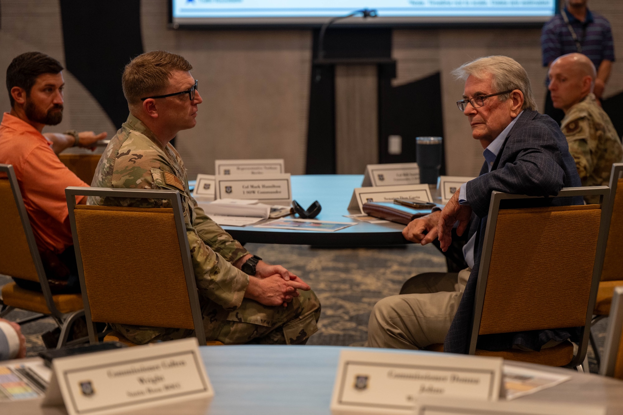 Col. Mark Hamilton, 1st Special Operations Wing commander, left, and Florida Sen. Don Gaetz, right, listen to ideas for traffic management during Air Force Special Operations Command’s traffic roundtable