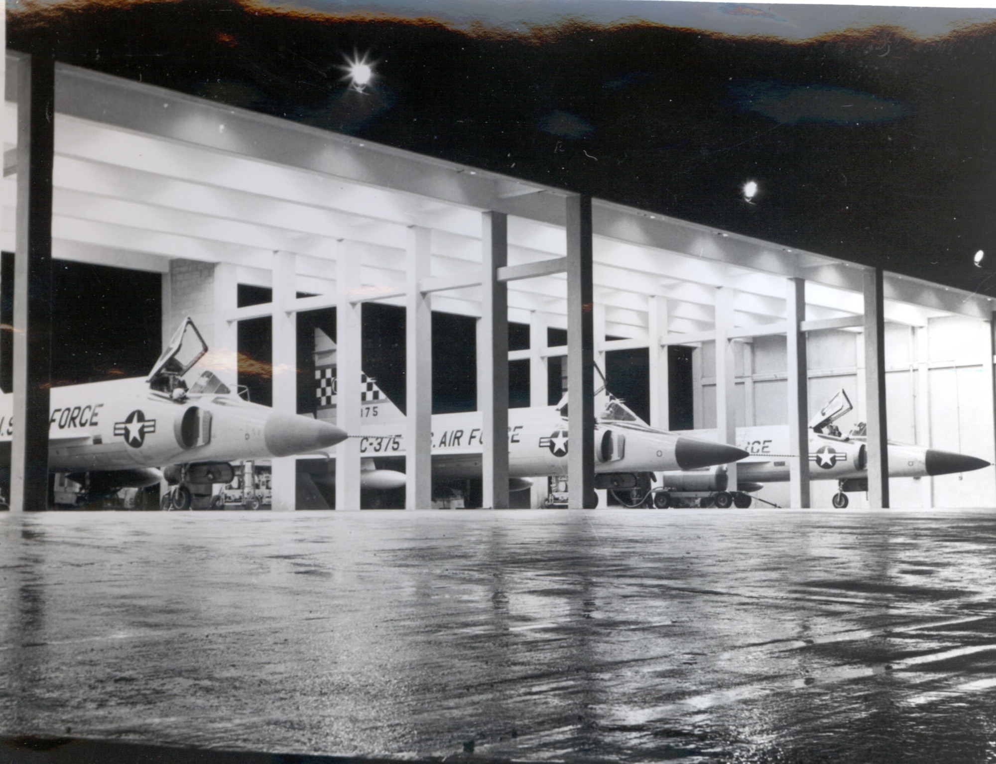 51st Fighter-Interceptor Wing F-102 Delta Daggers of the 16th Fighter-Interceptor Squadron parked under a hangar pavilion at Naha Air Base, Okinawa, circa 1966.