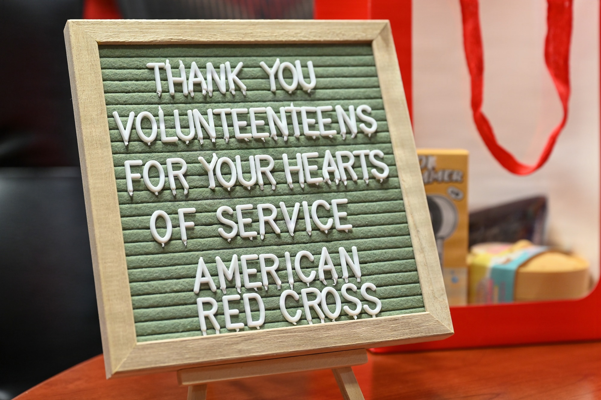A sign with words of thanks is displayed at the American Red Cross VolunTEEN summer program closing ceremony at Andersen Air Force Base, Guam, Aug. 13, 2026. The American Red Cross partnered with the 36th Medical Group to provide local youth with firsthand experience in a military medical environment while supporting the Andersen community. (U.S. Air Force photo by Airman 1st Class Charline Ebreo)