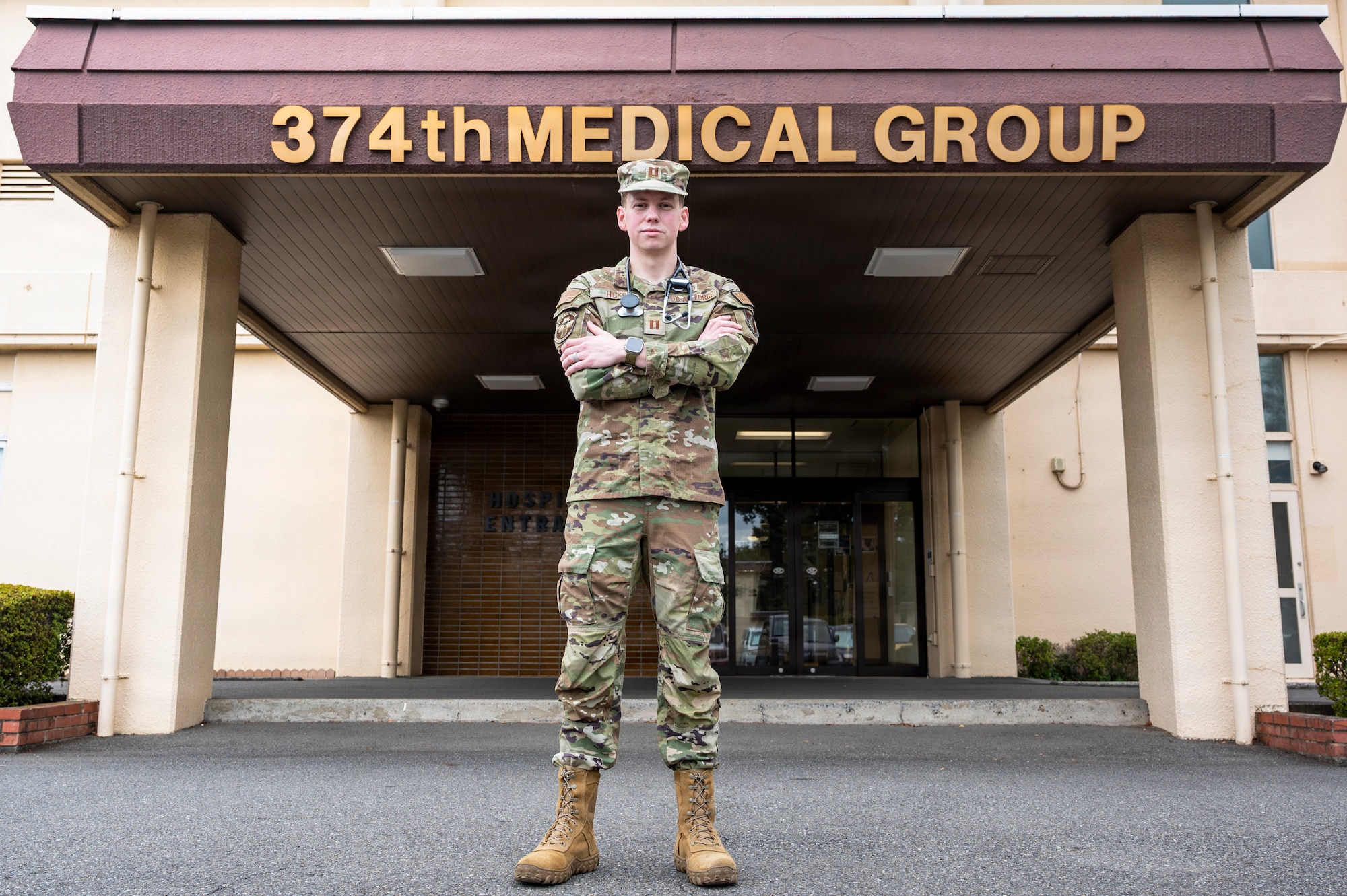 U.S. Air Force Capt. Zachary Hicks, 374th Health Care Operations Squadron, family medicine physician, poses for a photo outside the 374 HCOS at Yokota Air Base, Japan, Aug. 11, 2026.