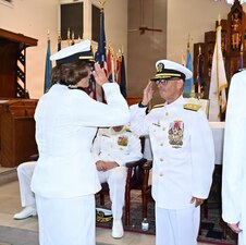 Capt. Cindi Palacios (left) assumed command of Navy Medicine Readiness and Training Command Jacksonville and director of Naval Hospital Jacksonville, during a ceremony at Naval Air Station Jacksonville All Saints Chapel, Florida, Aug. 13. Rear Adm. Robert Hawkins (right), Naval Medical Forces Atlantic commander, presided over the ceremony. (U.S. Navy photo by Julie M. Lucas, Naval Hospital Jacksonville/Released).