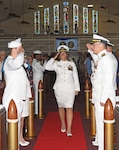 Capt. Cindi Palacios, Naval Hospital Jacksonville director and Navy Medicine Readiness and Training Command Jacksonville commander, salutes as she is piped aboard at All Saints Chapel during the change of command ceremony Aug. 13. Palacios will serve as the 48th commanding officer of the hospital’s 85-year history. (U.S. Navy photo by Kie Savage, Naval Hospital Jacksonville Public Affairs/released)