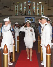 Capt. Cindi Palacios, Naval Hospital Jacksonville director and Navy Medicine Readiness and Training Command Jacksonville commander, salutes as she is piped aboard at All Saints Chapel during the change of command ceremony Aug. 13. Palacios will serve as the 48th commanding officer of the hospital’s 85-year history. (U.S. Navy photo by Kie Savage, Naval Hospital Jacksonville Public Affairs/released)