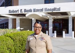Hospital Corpsman 1st Class Meosha P. Williams, a medical laboratory technician assigned to Navy Medicine Readiness and Training Command Twentynine Palms, poses for a photo in front of Robert E. Bush Naval Hospital, Aug. 7, 2026. Williams was recently recognized with the Omicron Sigma award, a national President’s Honor Roll award presented by the American Society for Clinical Laboratory Science for outstanding service and dedication to the clinical laboratory science profession. (U.S. Navy photo by Hospital Corpsman 3rd Class Evelyn Zermeno).